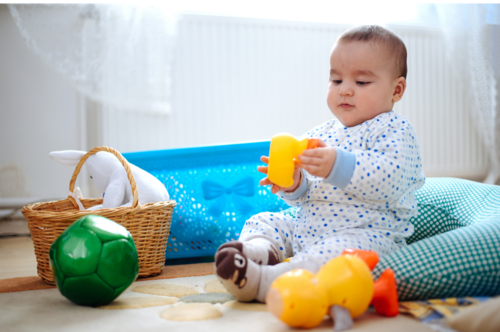 a baby playing with toys